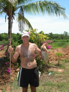 Mike with freshwater pomfret fish caught with bamboo pole